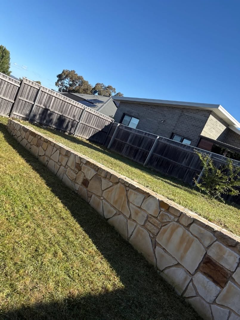 A freshly mowed lawn with perfect stripes, showcasing professional grass mowing results.
